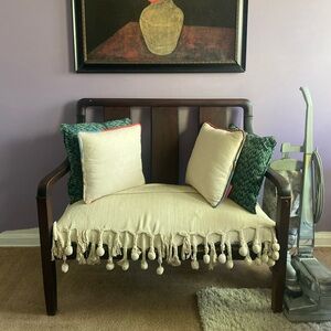 Wooden bench with gray and white seat